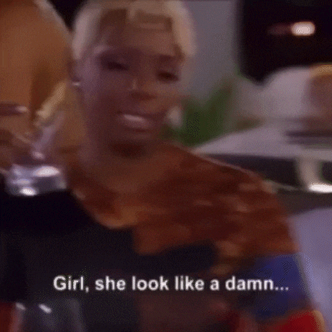 a woman is crying and saying `` girl , she look like a damn ... '' while holding a glass of wine .