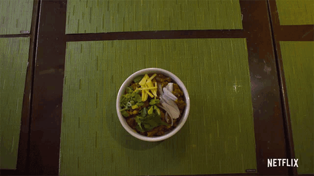 several bowls of food on a table with a netflix logo