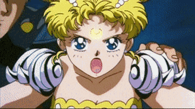 a girl in a yellow and white dress is being held by someone