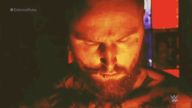 a close up of a man 's face with the words " extreme rules " on the bottom