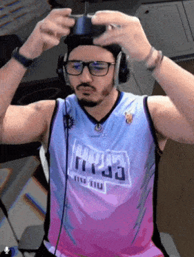 a man wearing headphones and a jersey that says hyss on it