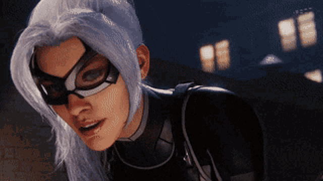a close up of a woman wearing a black suit and mask