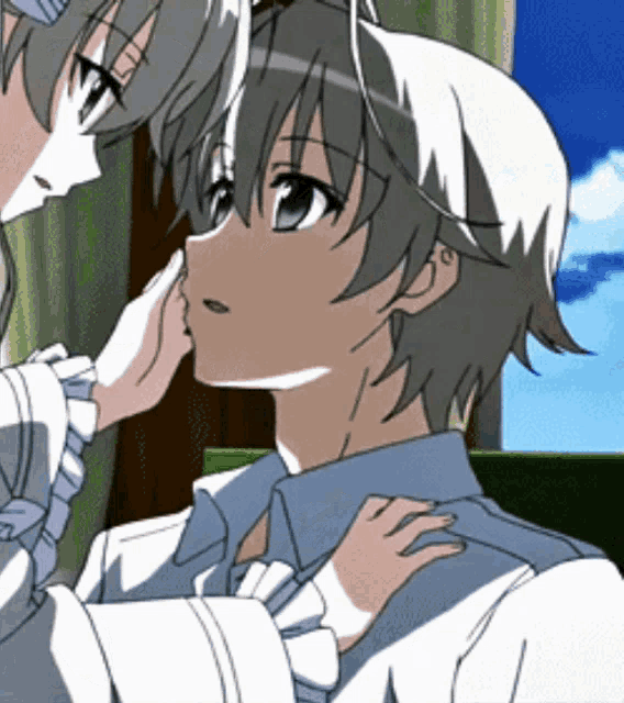 a girl touching a boy 's face in a cartoon