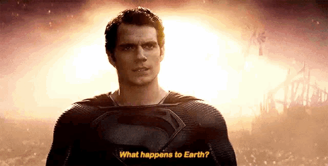 a man in a superman costume is standing in front of a sun and says `` what happens to earth ? ''