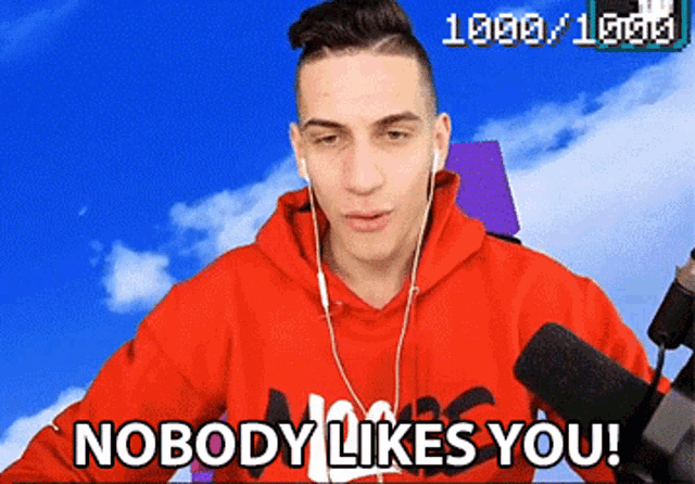 a man wearing headphones and a red nike hoodie says nobody likes you