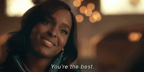 a close up of a woman smiling and saying `` you 're the best '' .