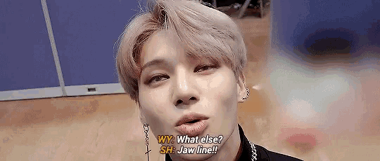 a close up of a person 's face with a caption that says why what else sh jaw line