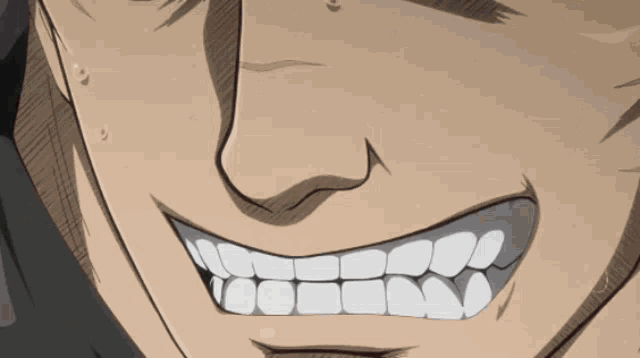 a close up of a man 's face with a big smile on it