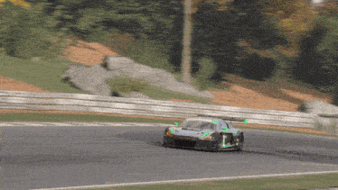 a race car with the number 1 on the side is going around a curve