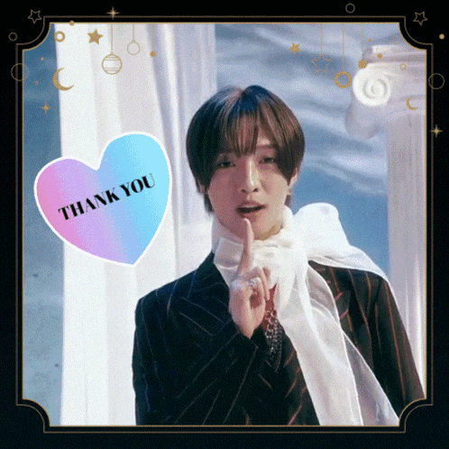 a man in a suit has a heart that says thank you