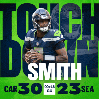 a football player named smith is holding a ball