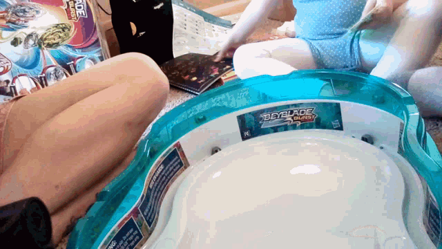 a toy that says beyblade on it is sitting on the floor
