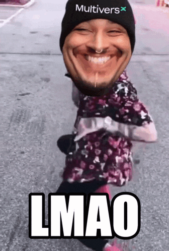 a man wearing a hat that says multivers on it is smiling and says lmao