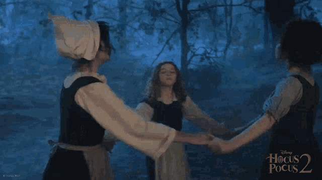 a group of girls are dancing in a circle with the words hocus pocus 2 on the bottom