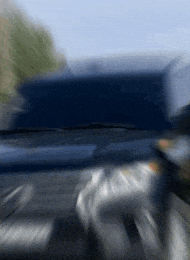 a blurry picture of a car with a license plate that says ' a ' on it