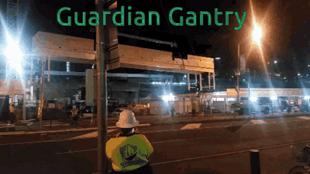 a construction site at night with guardian gantry written on the top