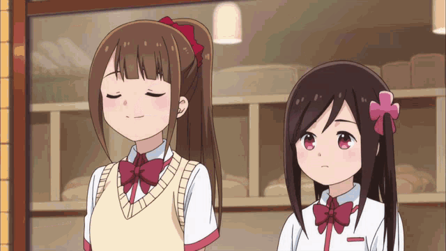 two anime girls are standing next to each other in front of a window