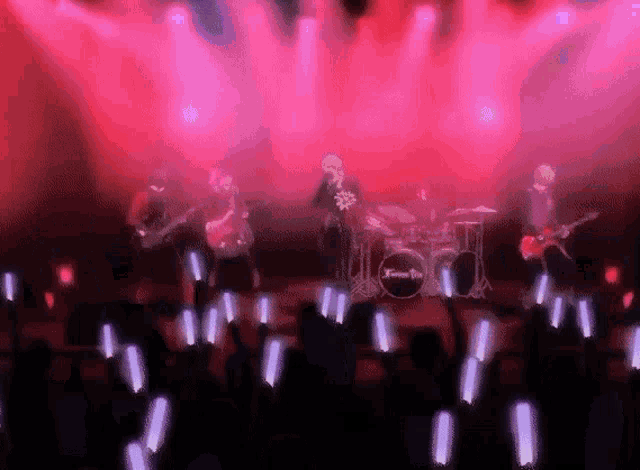 a group of people playing instruments on a stage with a drum set that says ' twice ' on it