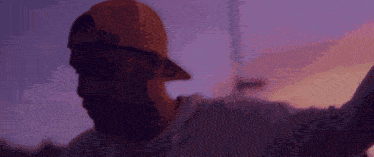 a close up of a man wearing a hat that says ' nike ' on it