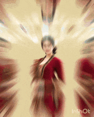 a blurry picture of a woman in a red dress with inshot written on the bottom right corner