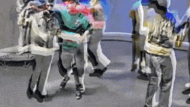 a group of people are dancing in a room