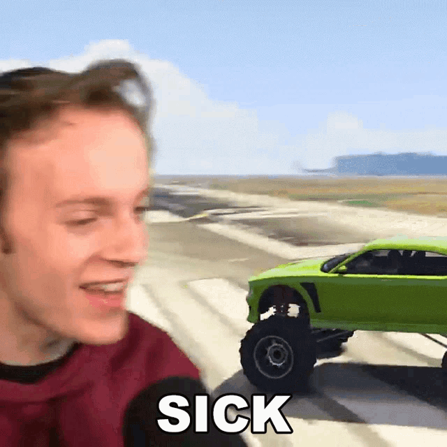 a man is standing in front of a green monster truck that says sick on it