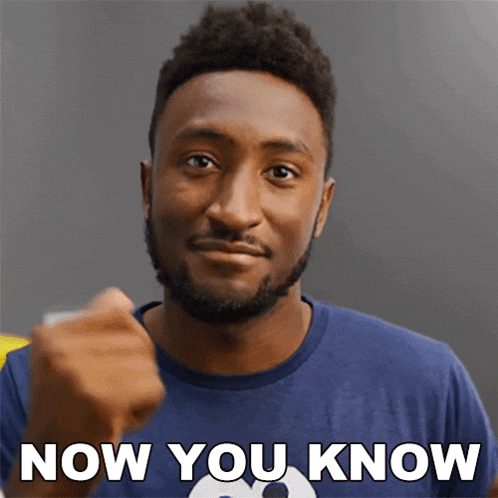a man in a blue shirt is giving a fist bump with the words now you know below him