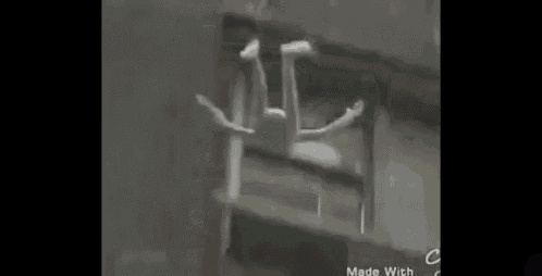 a person is walking down a street at night .