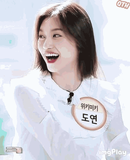 a girl with a name tag that says ' oth ' on it is smiling