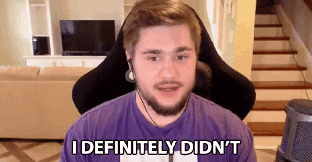 a man in a purple shirt is saying i definitely didn 't