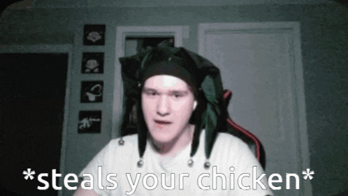 a man wearing a jester hat is saying " * steals your chicken * "