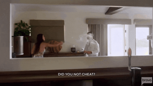 a man and a woman are standing in a room with bravo written on the bottom