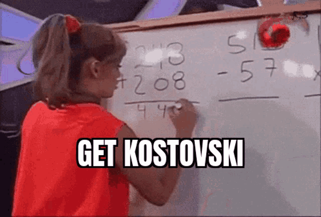 a girl in a red shirt is writing on a white board and the words get kostovski are above her