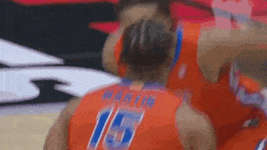 a basketball player has the number 15 on his jersey