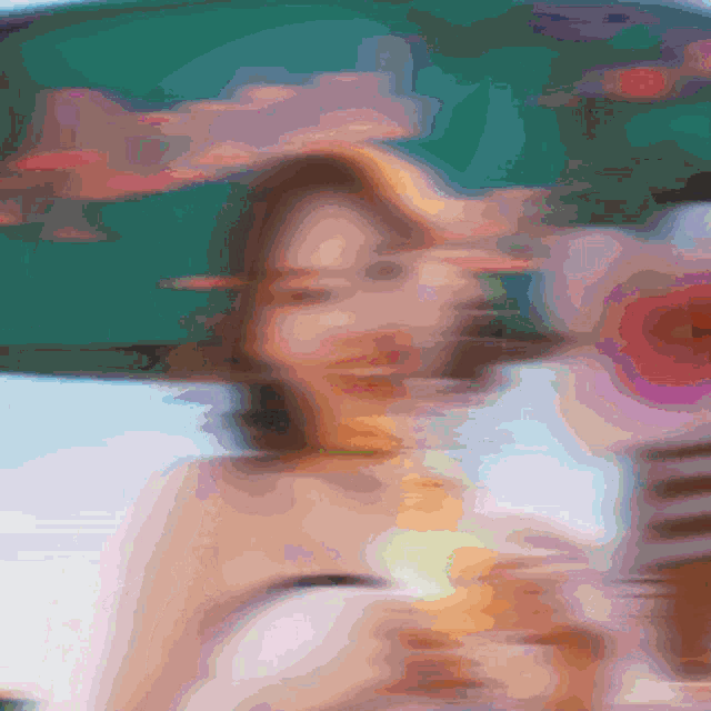 a blurry picture of a woman holding an umbrella in her hand