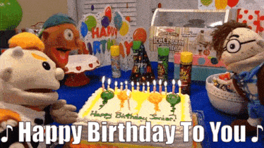 a birthday cake with candles and the words happy birthday to you on it