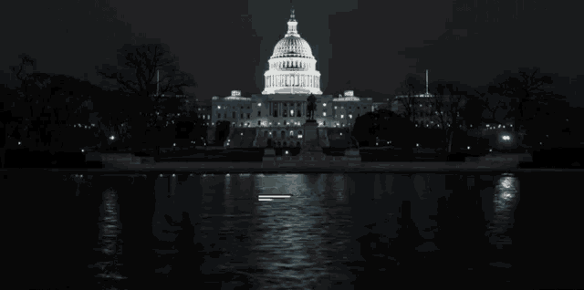 a picture of the capitol building at night with the words house of cards below it