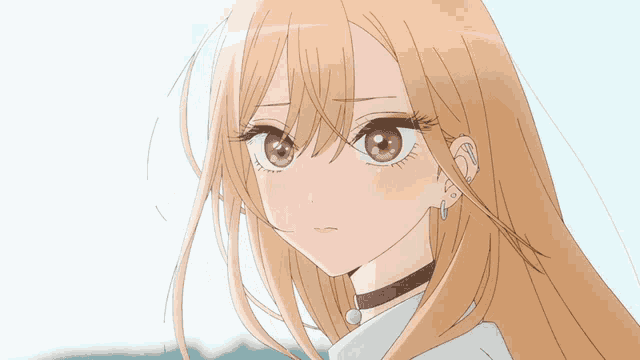 a close up of a girl 's face with long blonde hair
