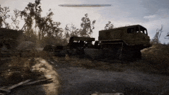 a large truck is parked on the side of the road in a field .