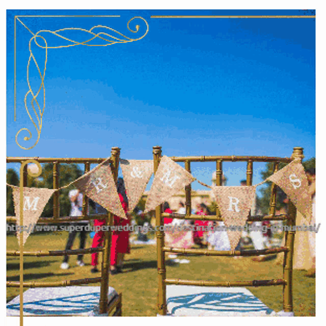 a picture of a wedding ceremony with a banner that says mr and mrs