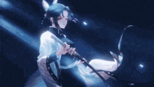 a girl is holding a sword in a dark room with a light shining on her .