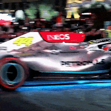 a race car with the word neos on the front