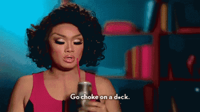a woman in a pink tank top is holding a can and saying " go choke on a dick "