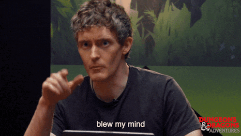 a man in a dungeons and dragons shirt is talking