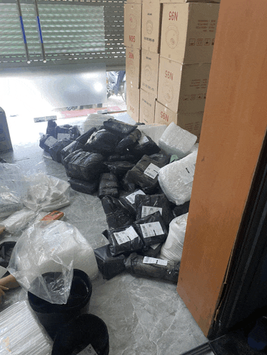 a bunch of boxes that say n95 are on the floor
