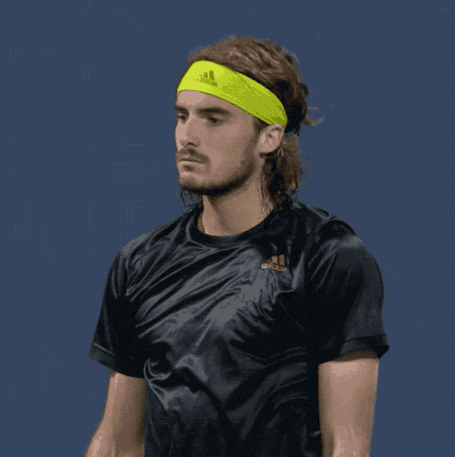 a man wearing a headband that says adidas