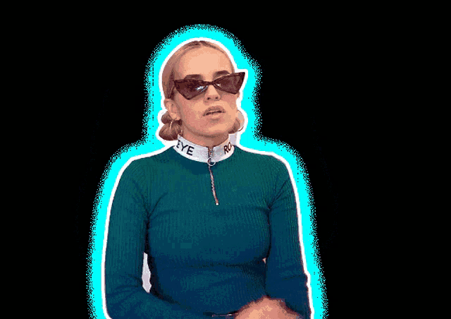 a woman wearing sunglasses and a shirt that says eye on the collar