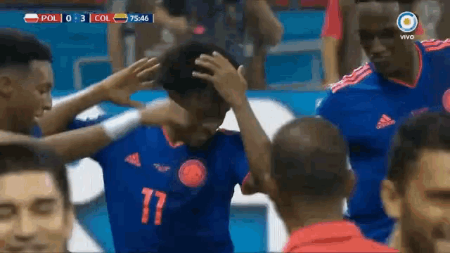 a soccer player wearing a blue jersey with the number 17 on it