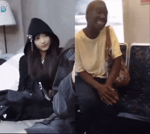 a woman in a black hoodie sits next to a man in a white shirt