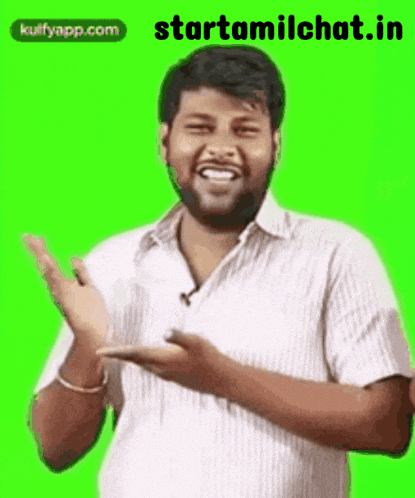 a man with a beard is clapping his hands on a green background .